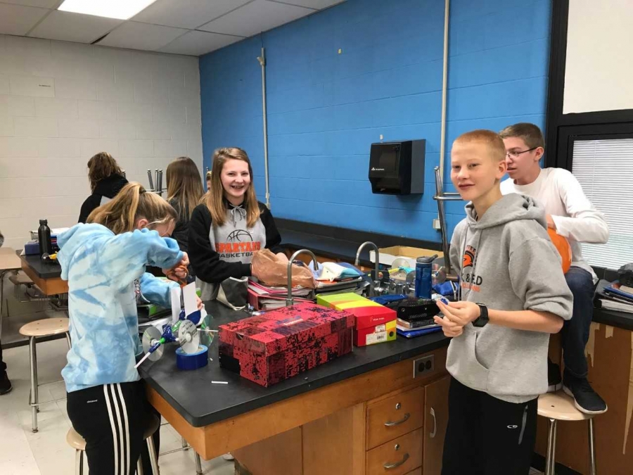 students smiling in a science lab
